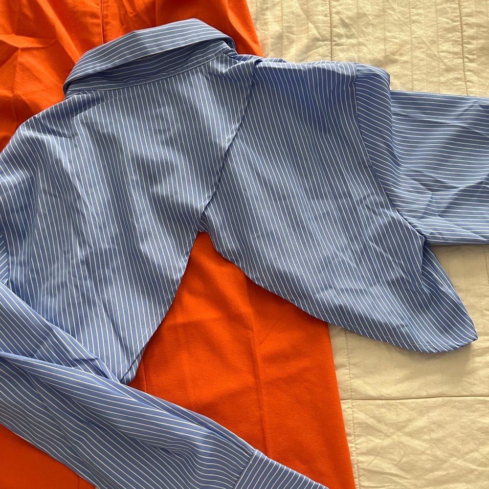 Cropped, blue and white striped button up with open back. New with tags.
